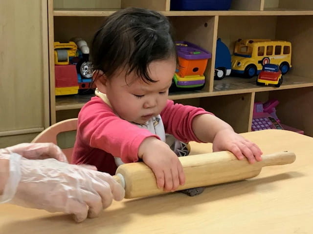 a baby playing with a toy