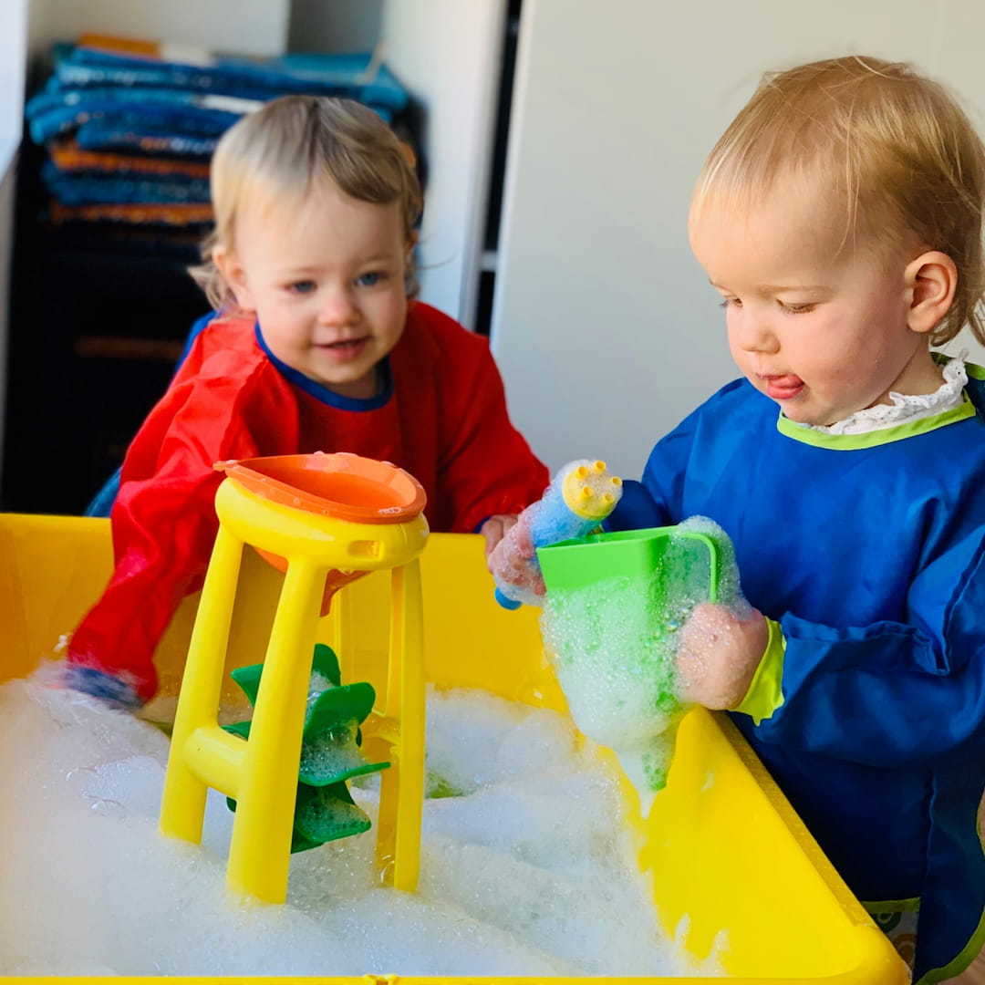 two children playing with toys