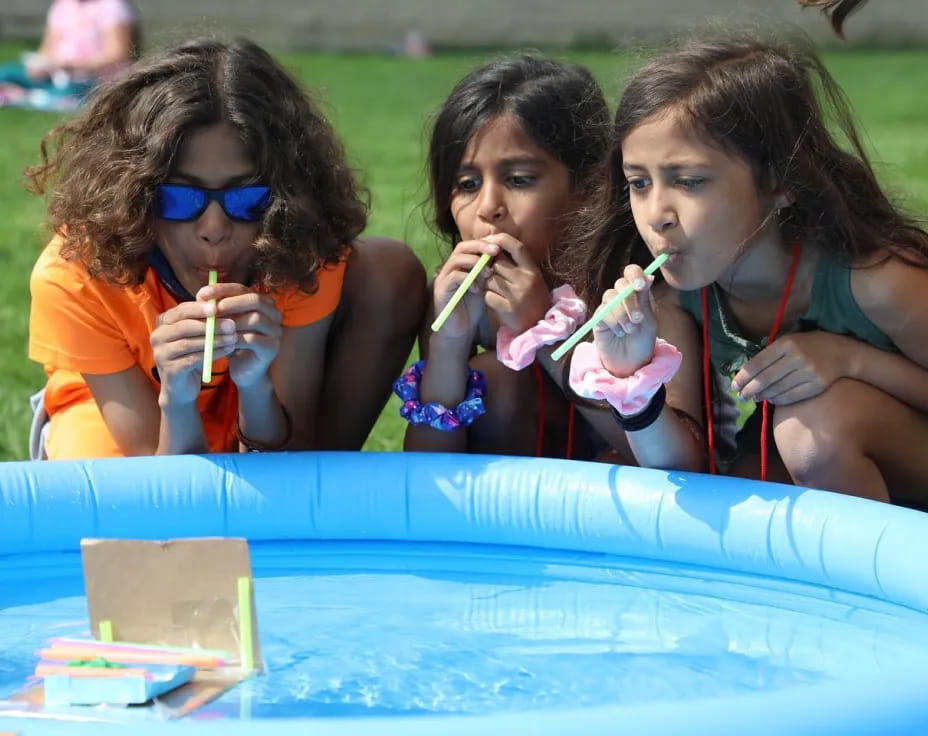 a group of girls eating ice cream