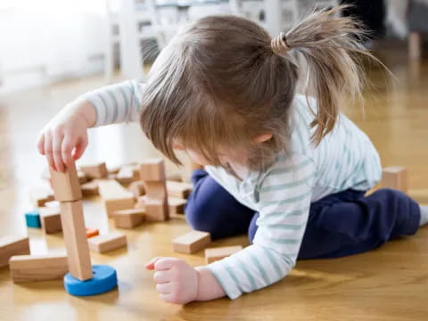 a child playing with building blocks