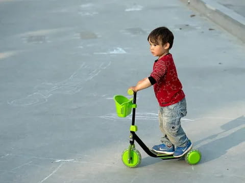 a young boy riding a skateboard