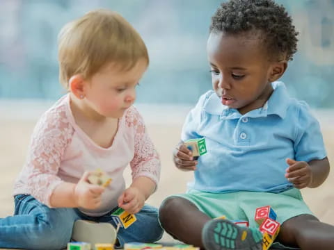 a couple of young children playing with toys