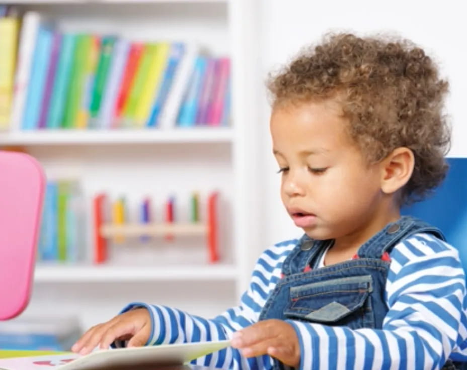 a baby reading a book