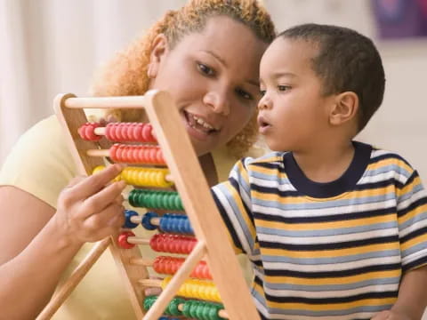 a boy and girl playing with toys