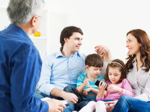 a family sitting on the floor