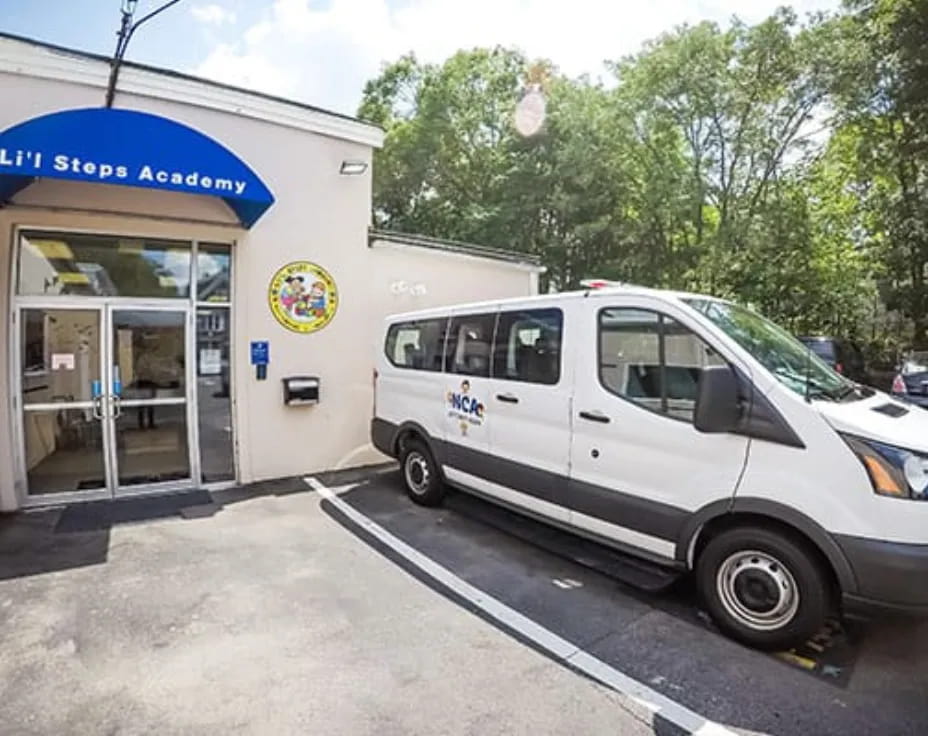 a white van parked outside a store