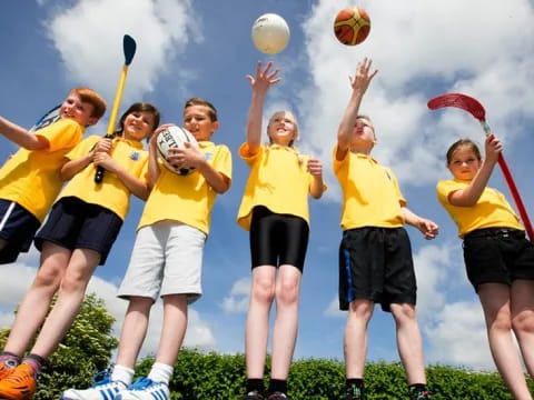 a group of people playing volleyball