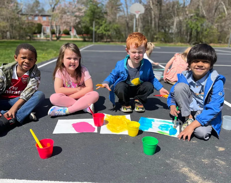 a group of kids painting