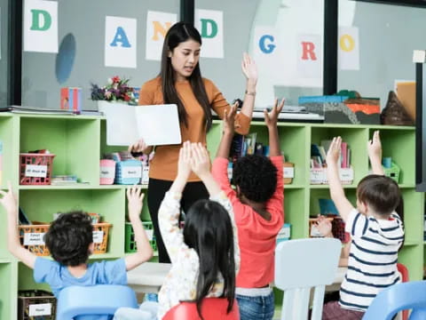 a teacher teaching her students