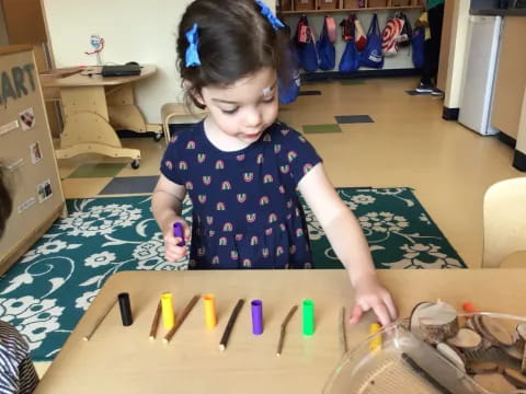 a young girl playing with toys