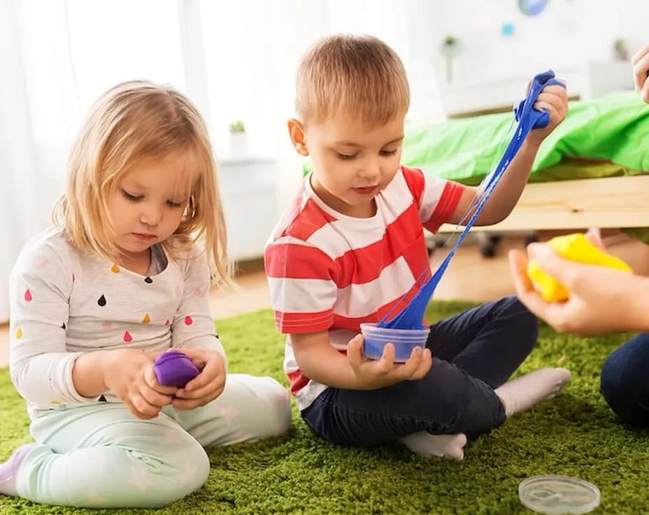 a couple of children playing with toys