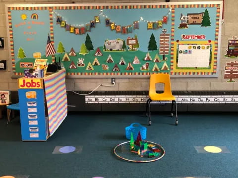 a child playing on a trampoline in a classroom