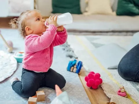 a baby drinking from a bottle