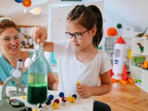 a person and a girl in a lab