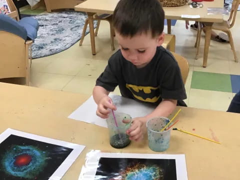 a child painting on a table