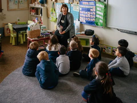 a person teaching a group of children