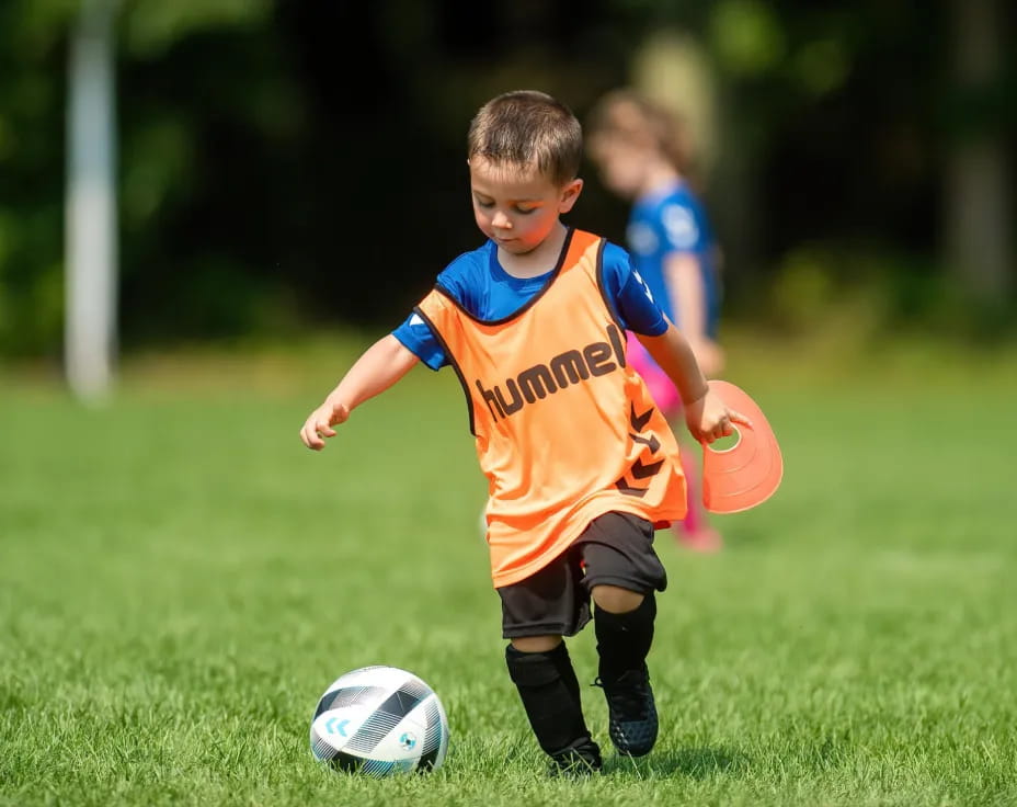 a kid playing football