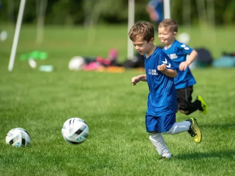 kids playing football on a field