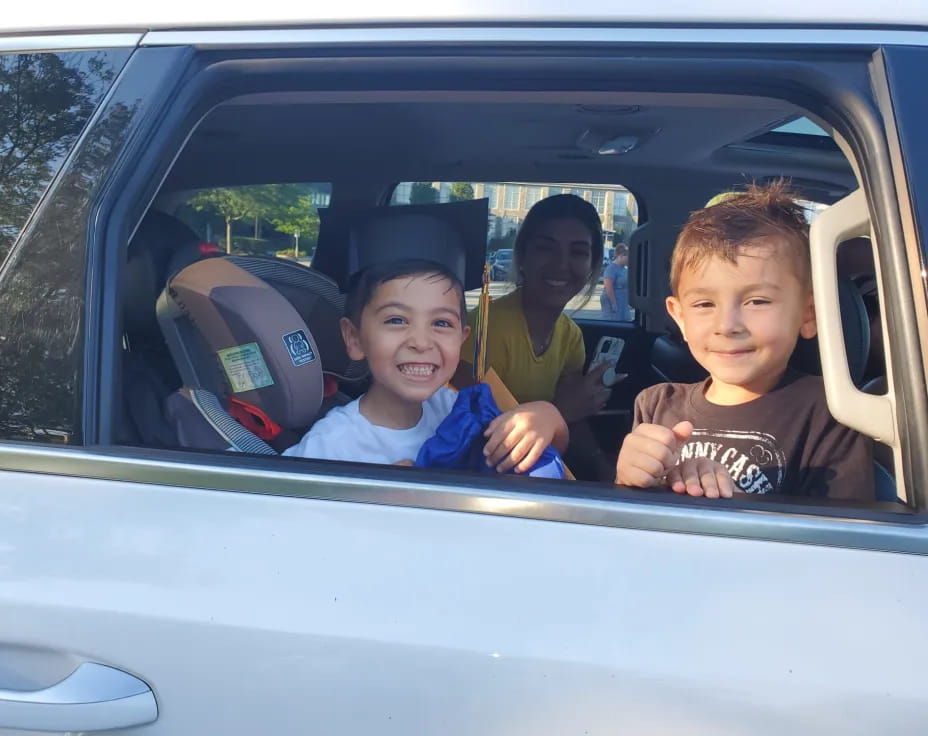 a group of kids in a car