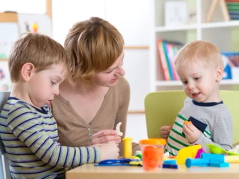 a group of children sitting at a table