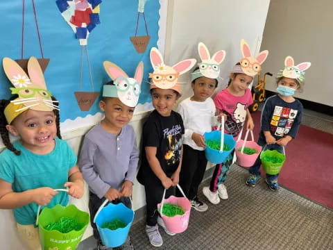 a group of children wearing party hats