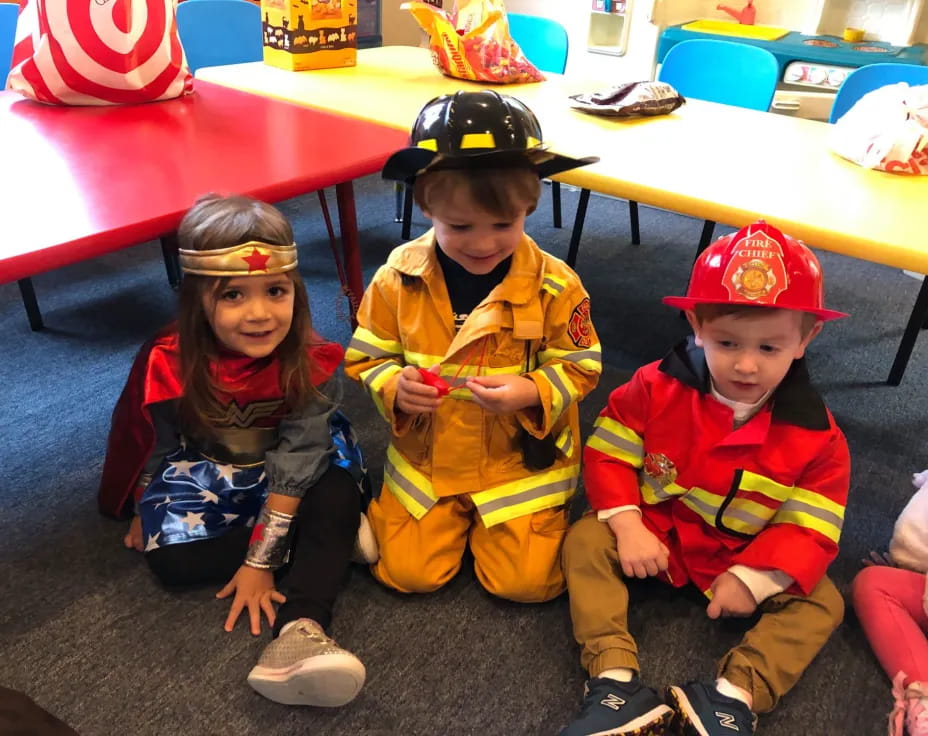 a group of children sitting on the floor