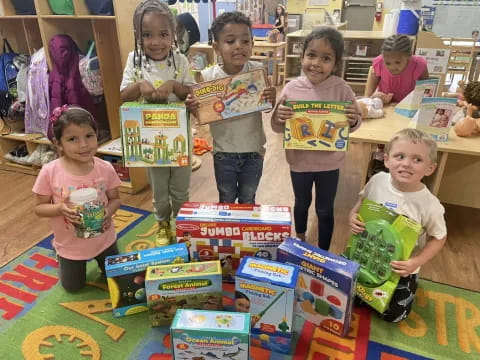 a group of children holding boxes