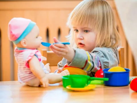 a couple of young children eating