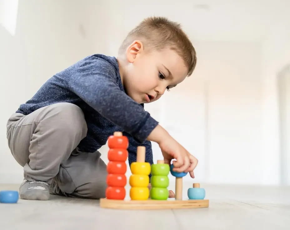 a baby playing with toys