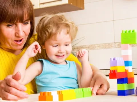 a person and a child playing with toys