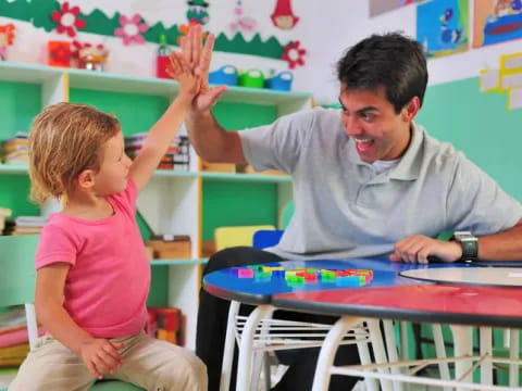 a person and a child in a classroom