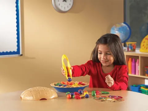 a girl eating with a spoon