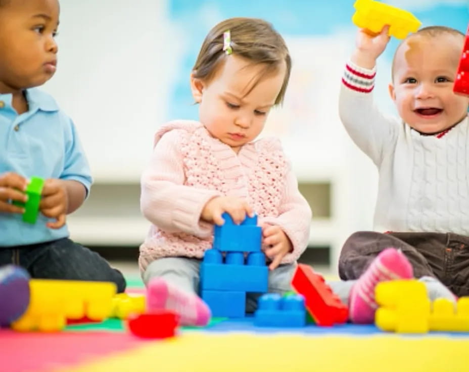 a group of children playing with toys