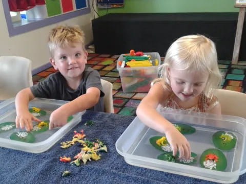 a couple of kids playing with toys