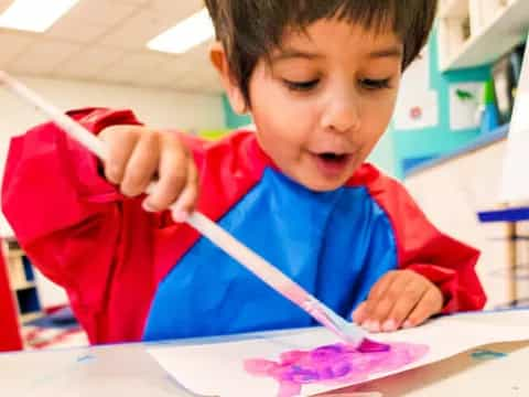 a young boy painting