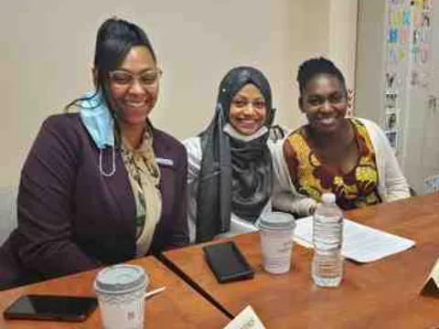 a group of people sitting at a table