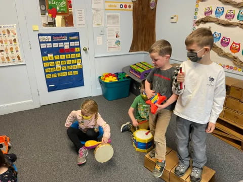 a group of children playing with toys