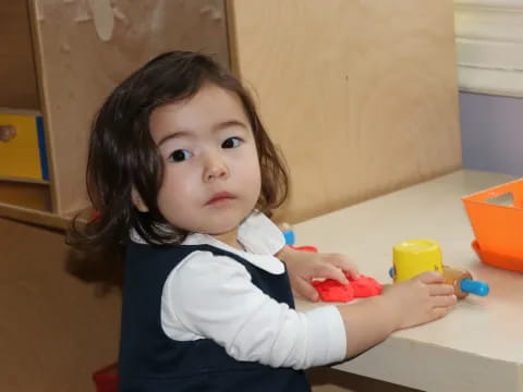 a child sitting at a table