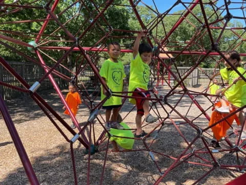 a group of kids playing on a playground