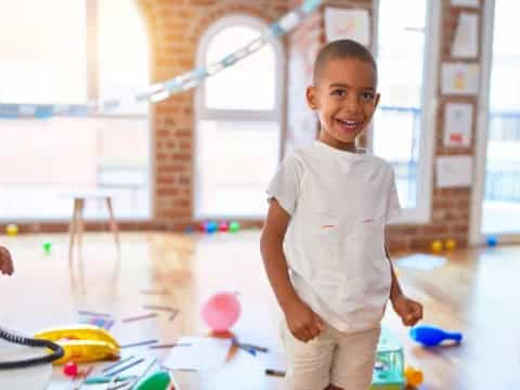 a boy standing in a room