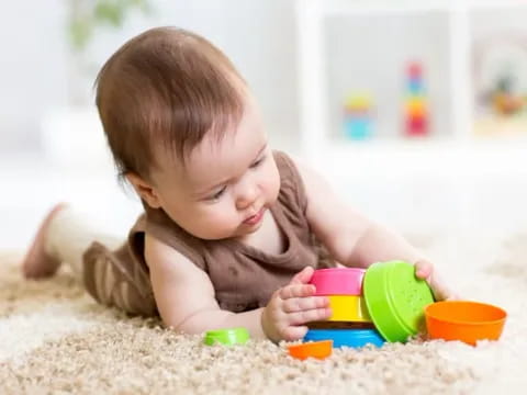 a baby playing with toys