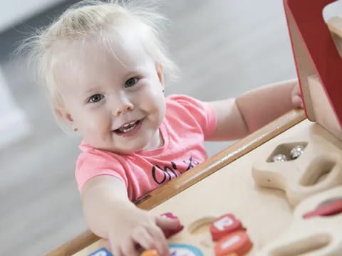 a baby playing with toys