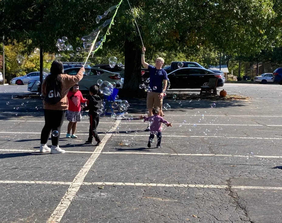 a group of people playing in a parking lot