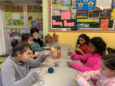 a group of children sitting at a table