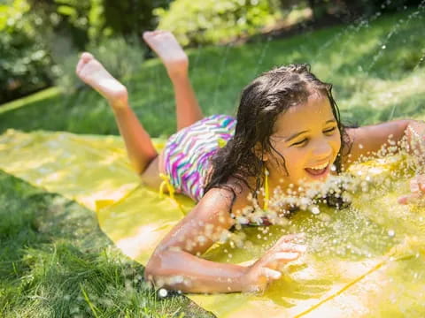 a girl lying in a hot tub