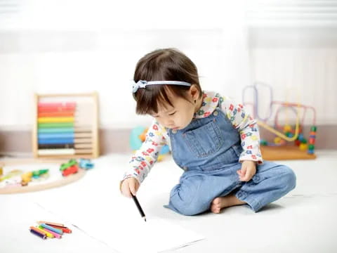 a baby sitting on the floor