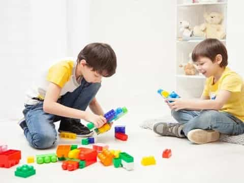 a couple of boys playing with toys