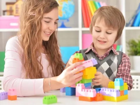 a person and a child playing with toys