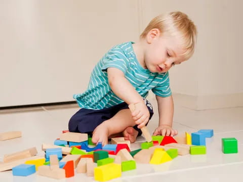 a child playing with blocks