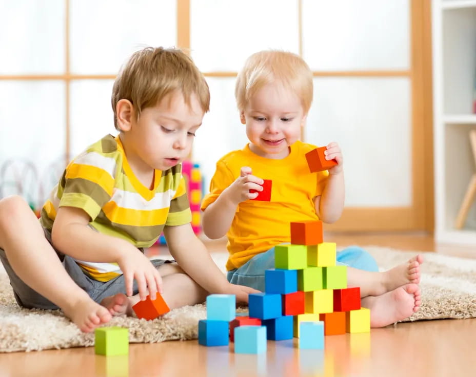 two children playing with toys